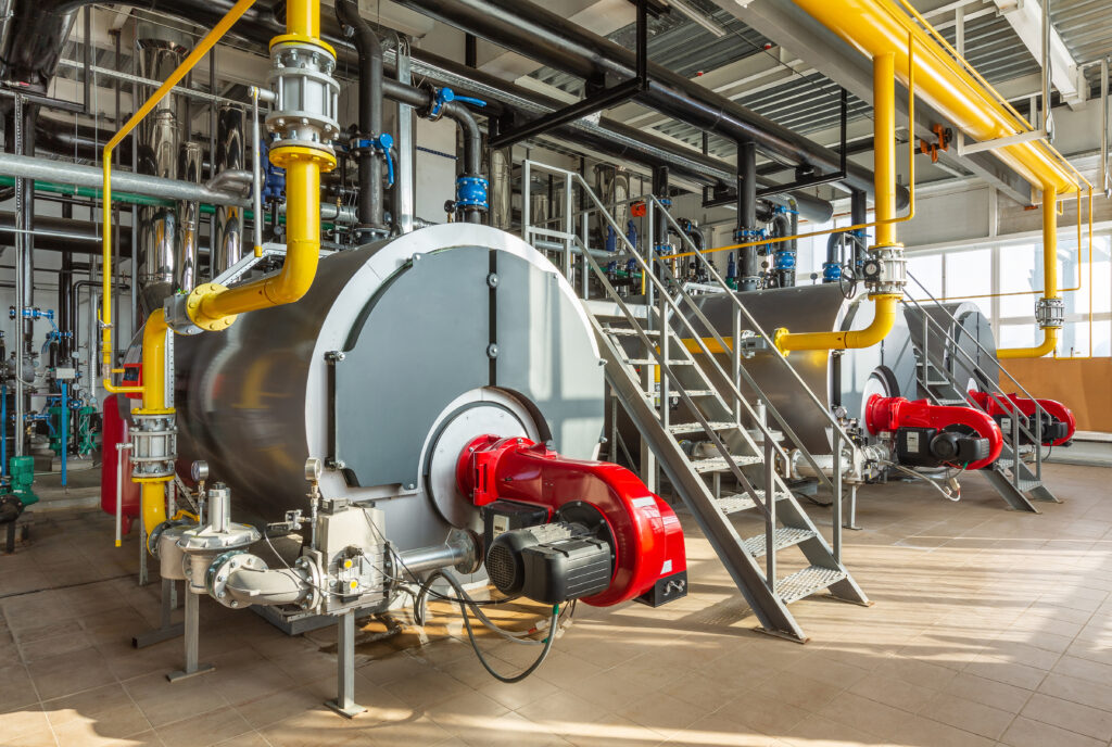 The,Interior,Of,An,Industrial,Boiler,Room,With,Three,Large